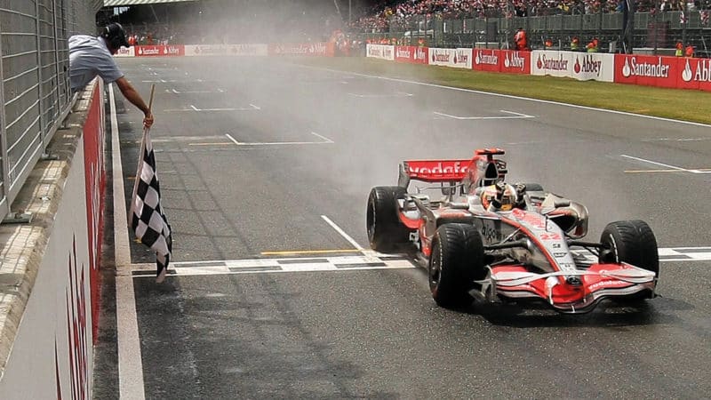 Lewis Hamilton crosses the line to win the 2008 British Grand Prix