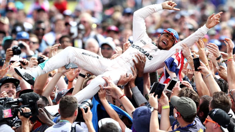 Lewis Hamilton crowd surfs after winning the 2016 British Grand Prix
