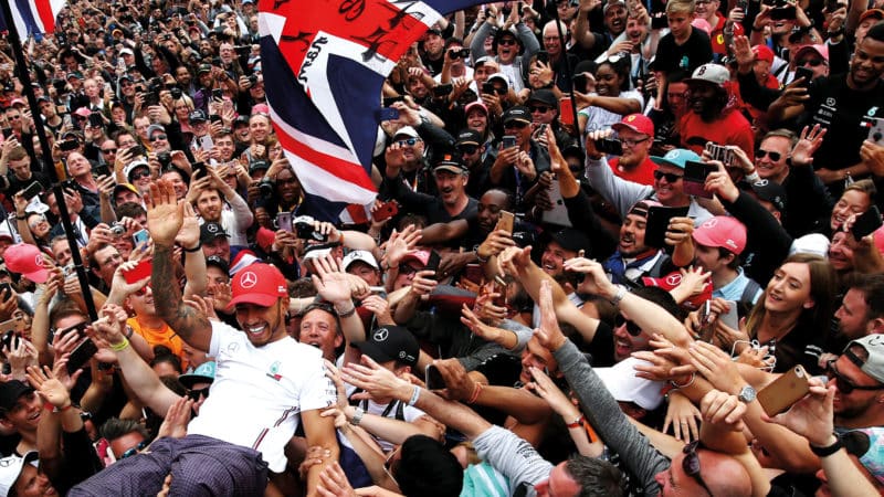 Lewis Hamilton crowd surfs at the 2019 British Grand Prix
