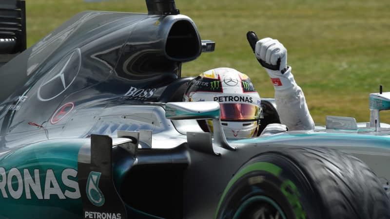 Lewis Hamilton gives the thumbs up from his Mercedes cockpit after winning the 2015 British Grand Prix