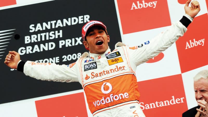 Lewis Hamilton on the podium after winning the 2008 British Grand Prix