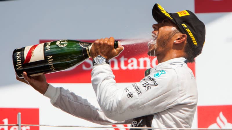 Lewis Hamilton sprays champagne after winning the 2014 British Grand Prix