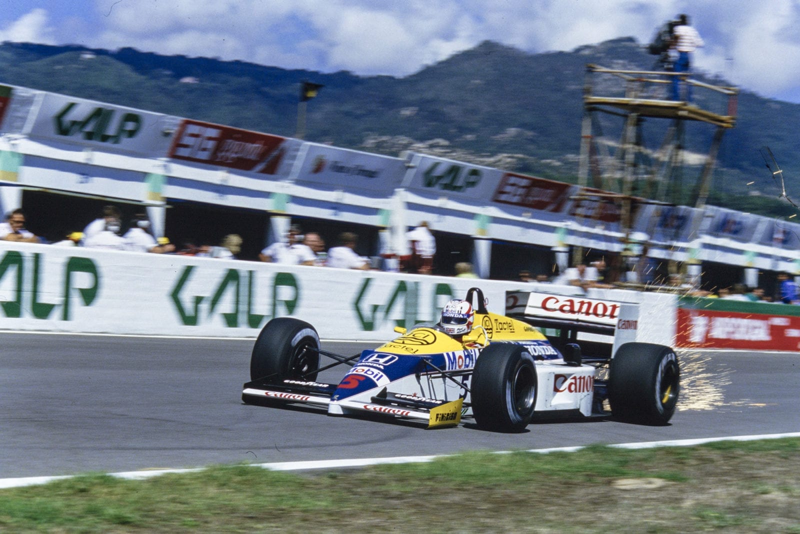 Sparks fly from Nigel Mansell's Williams in the 1986 Portuguese Grand Prix