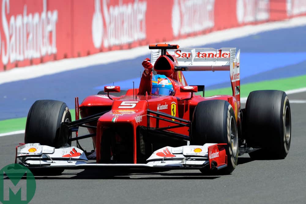Fernando Alonso celebrates victory in the 2012 European Grand Prix at Valencia