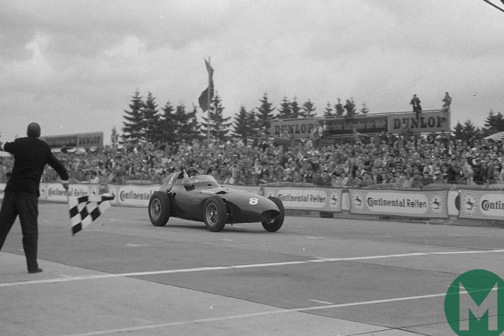 Tony Brooks in a Vanwall takes the flag after a magnificent 1958 German Grand Prix comeback win