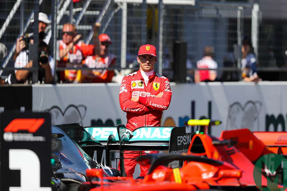 Charles Leclerc watches his car parked in the No1 spot after he qualified on pole for the 2019 Austrian Grand Prix