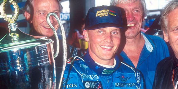 Johnny Herbert's Benetton takes the flag in the 1995 British Grand Prix