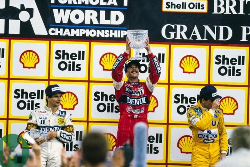 Nigel Mansell on the top step of the podium at the 1987 British Grand Prix