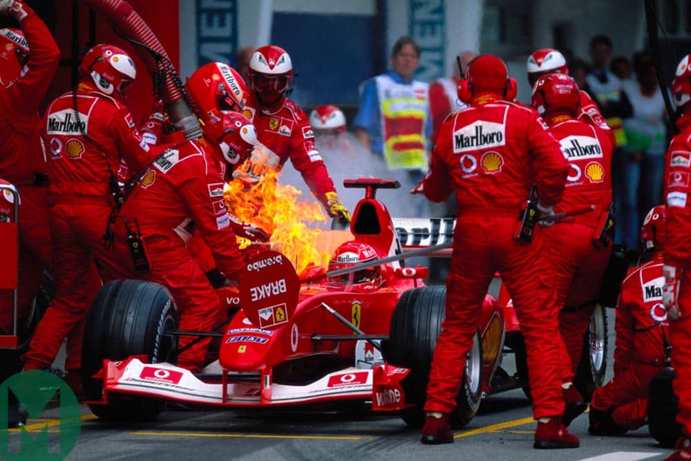 Michael Schumacher in the Ferrari as a fire breaks out during a pit stop at the 2003 Austrian Grand Prix