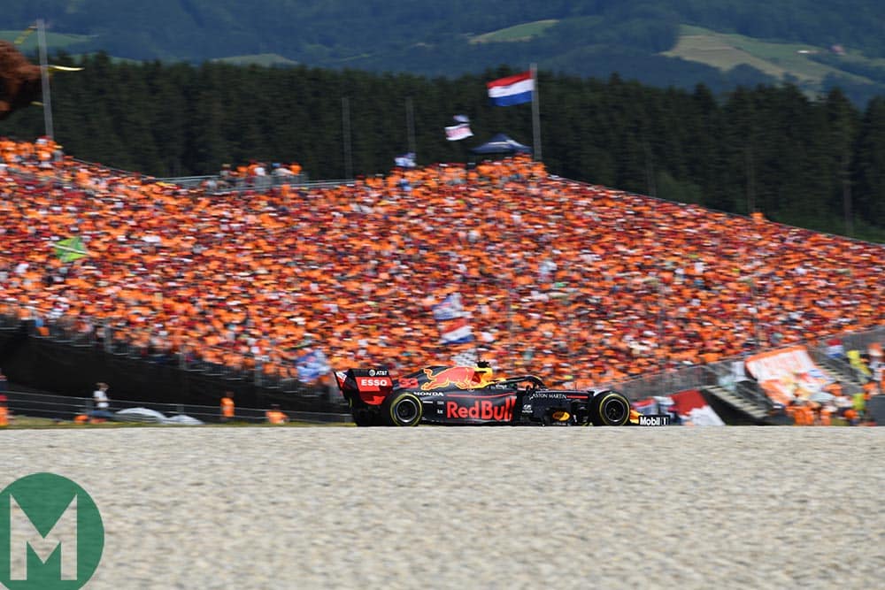 Max Verstappen in front of a grandstand of his orange army supporters at the 2019 Austrian Grand Prix