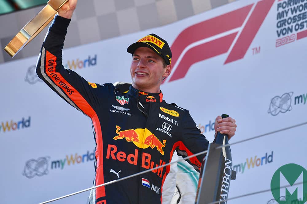 2019 Austrian Grand Prix winner Max Verstappen with trophy and champagne on the podium