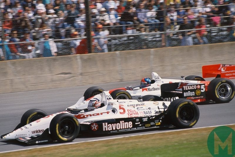 Mansell battles with Emerson Fittipaldi's Penske on the way to his rookie 1993 IndyCar championship