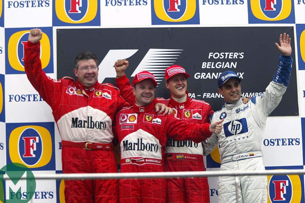 Ross Brawn on the Spa podium with 2002 Belgian Grand Prix-winner Michael Schumacher, 2nd-placed Rubens Barrichello and Juan Pablo Montoya, third,