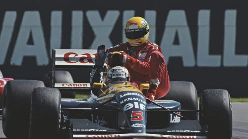 Nigel Mansell gives Ayrton Senna a lift after the 1991 Biritsh Grand Prix