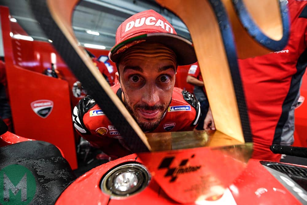 Andreas Dovizioso stares through his winner's trophy from the 2019 MotoGP Austrian Grand Prix
