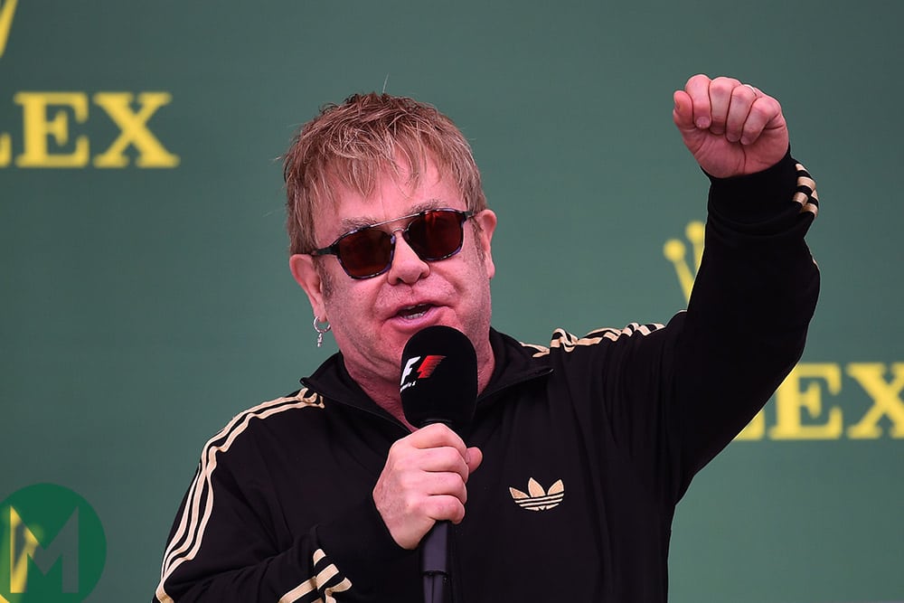 Sir Elton John on the podium at the 2015 United States Grand Prix