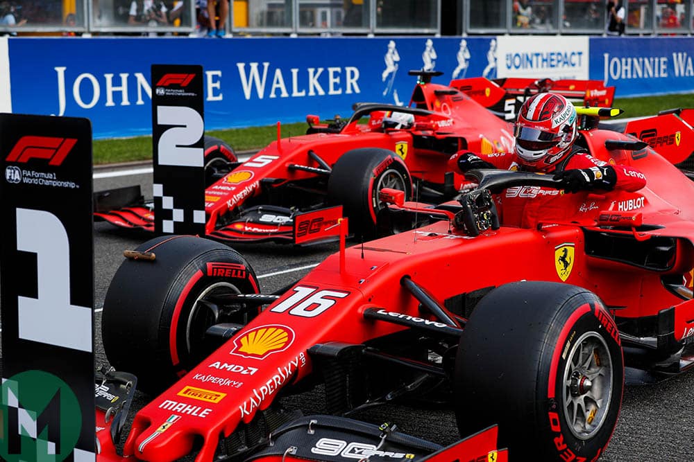Charles Leclerc and Sebastian Vettel park their Ferraris behind the one and two signs after qualifying for the 2019 Belgian Grand Prix