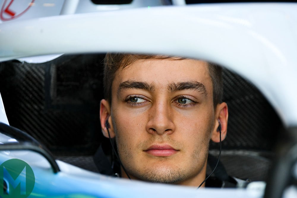 George Russell sitting in his Williams