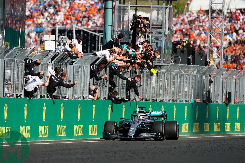 Hamilton takes the chequered flag and the applause of his Mercedes team