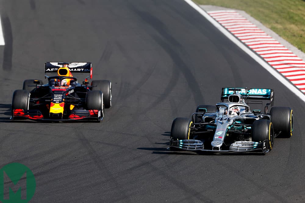 Lewis Hamilton's Mercedes gets by Max Verstappen's Red Bull late on
