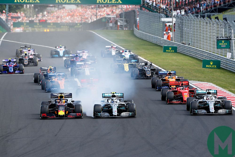 Max Verstappen's Red Bull holds onto the lead at the start while Valtteri Bottas's Mercedes lock ups