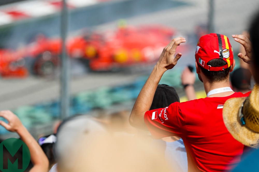 Ferrari fans watch as Charles Leclerc spins into the barrier at the 2019 Hungarian Grand Prix