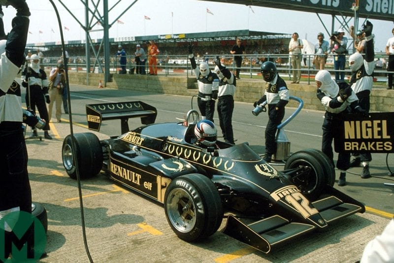 Nigel Mansell exits the pits in his Lotus 94T in the 1983 British Grand Prix