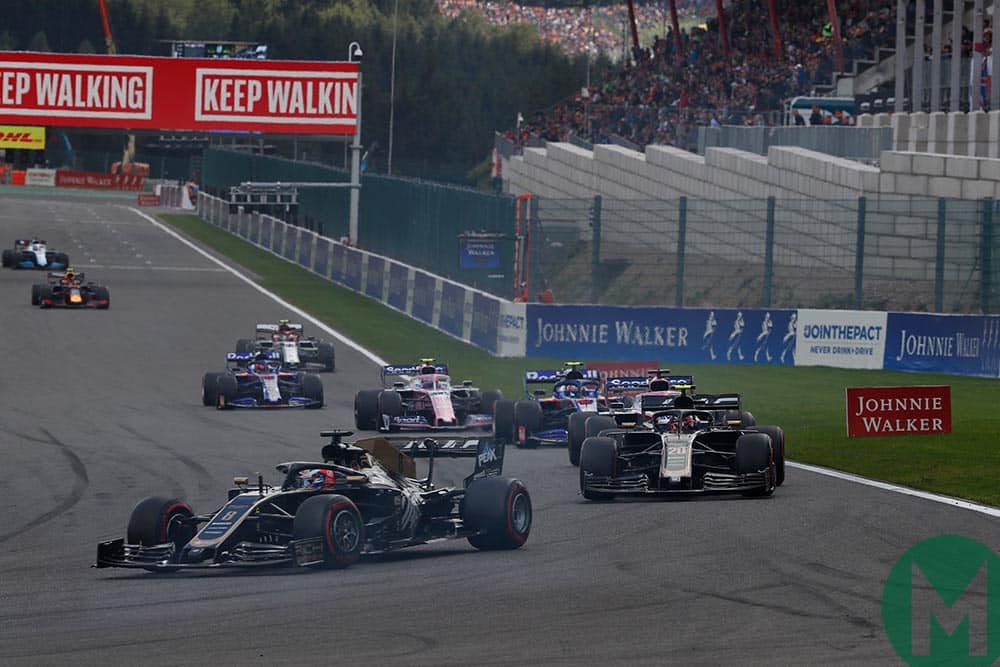 Romain Grosjean and Kevin Magnussen of Haas at the head of a long queue of cars at the 2019 Belgian Grand Prix