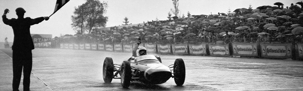 Stirling Moss crosses the line to win the 1961 German Grand Prix