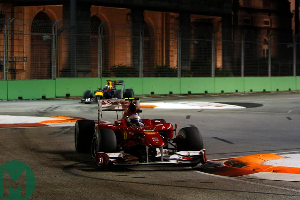 Fernando Alonso leads Sebastian Vettel during the 2010 Singapore Grand Prix