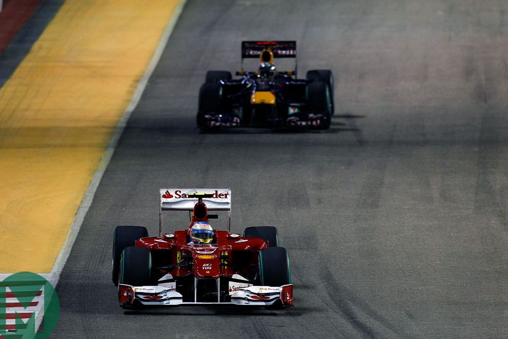 Fernando Alonso leads Sebastian Vettel during the 2010 Singapore Grand Prix
