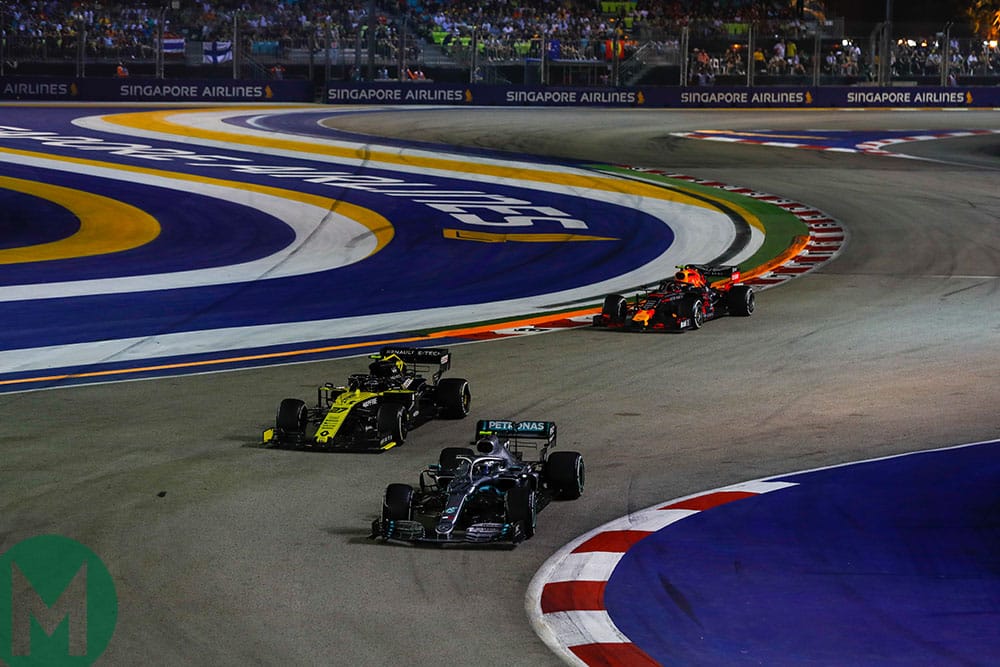 A slow-lapping Valtteri Bottas fends off Nico Hulkenberg and Alex Albon at the 2019 F1 Singapore Grand Prix