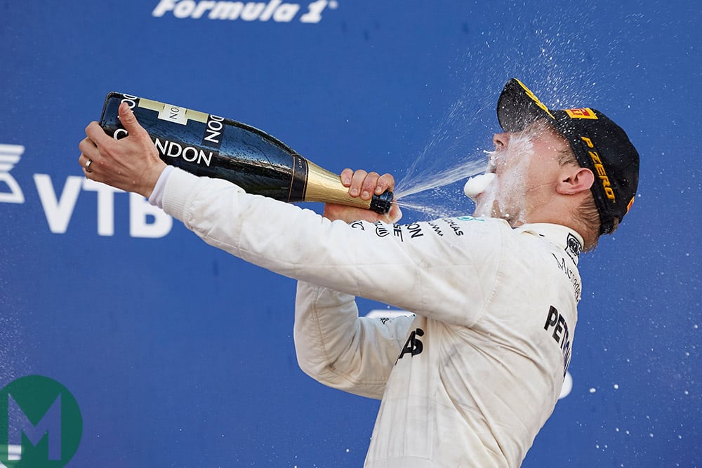 Valtteri Bottas sprays champagne into his mouth after winning the 2017 Russian Grand Prix