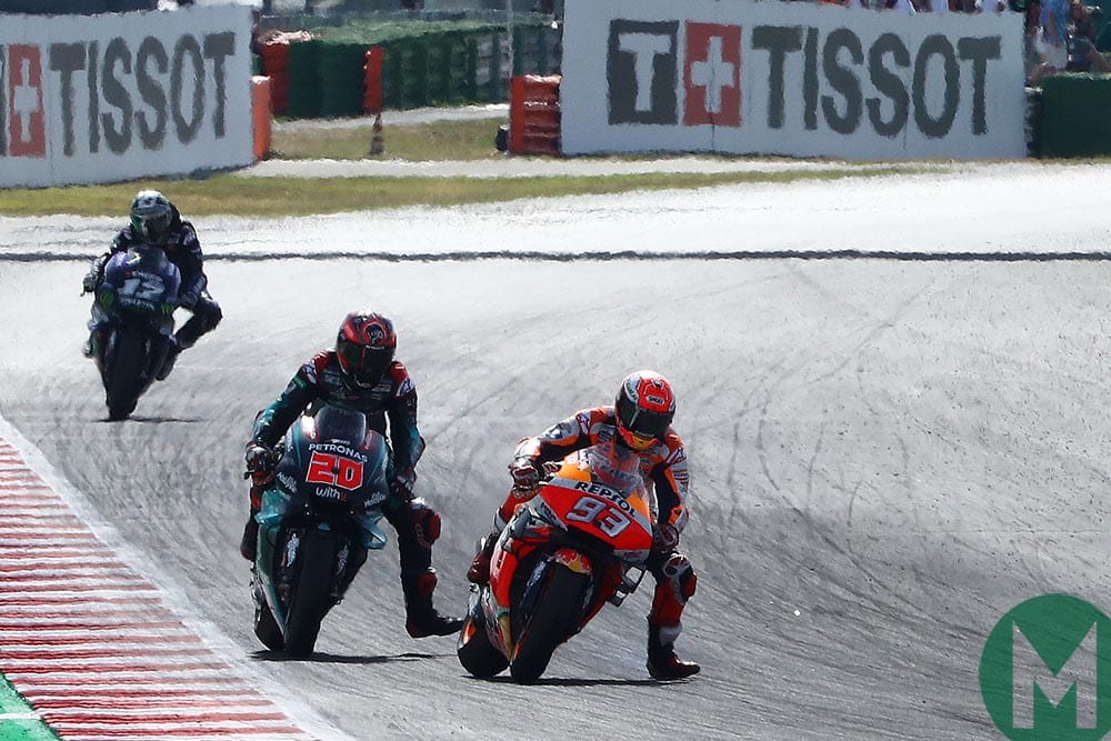 Marc Márques takes the lead from Fabio Quaratarao at the 2019 MotoGP San Marino Grand Prix, as both riders put their boots down at Turn Eight