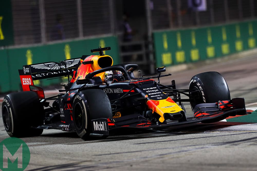 Max Verstappen's Red Bull hits the kerb at the 2019 F1 Singapore Grand Prix