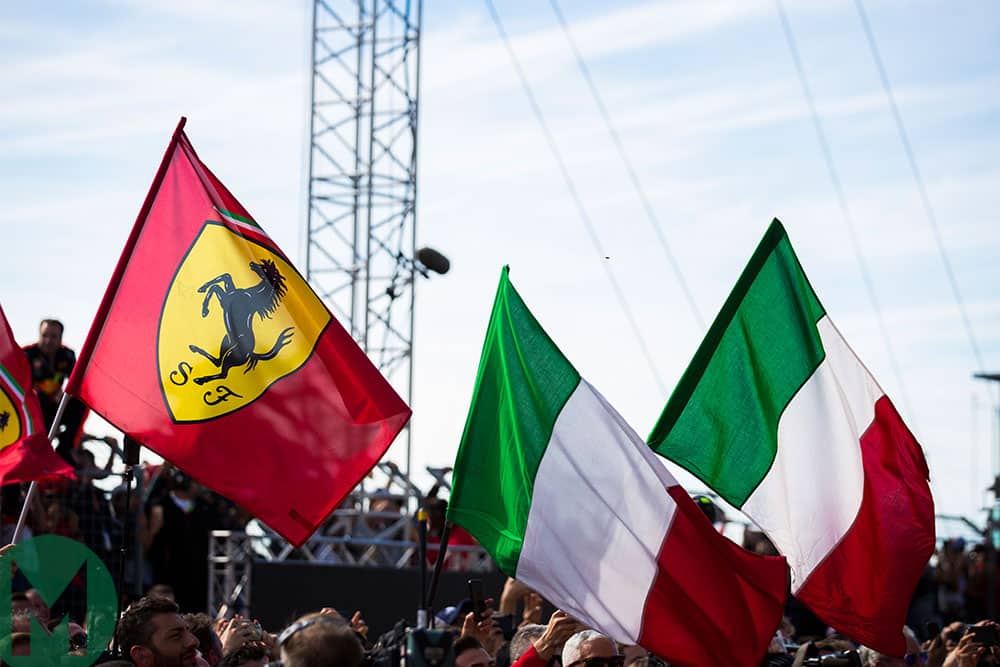 Ferrari and Italian flags underneath the Monza podium after the 2018 Italian Grand Prix