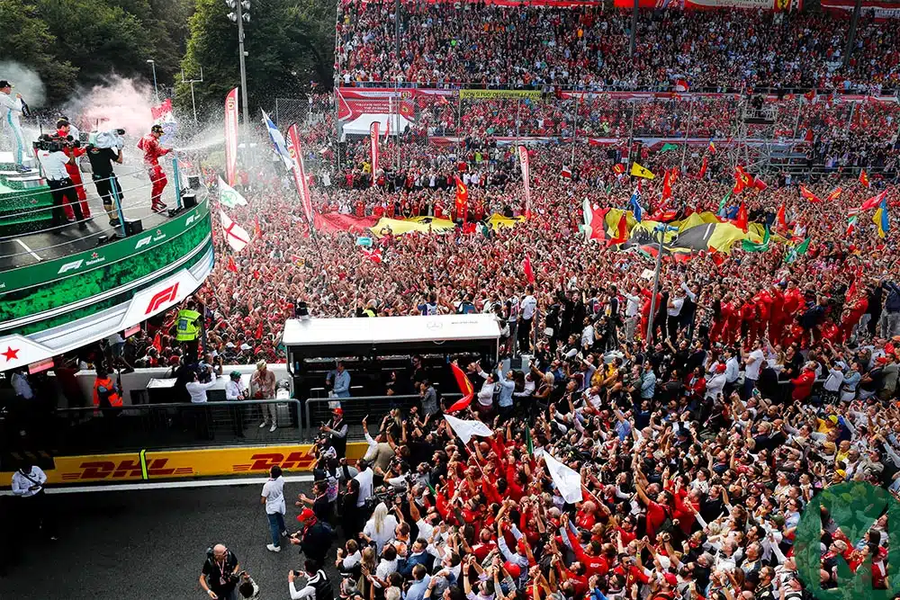 Podium champagne celebrations in front of thousands of Tifosi after Charles Leclerc wins he 2019 Italian Grand Prix at Monza
