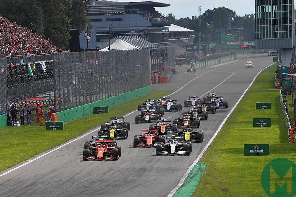 F1 cars get away from the grid in front of packed grandstands at the start of the 2019 Italian Grand Prix