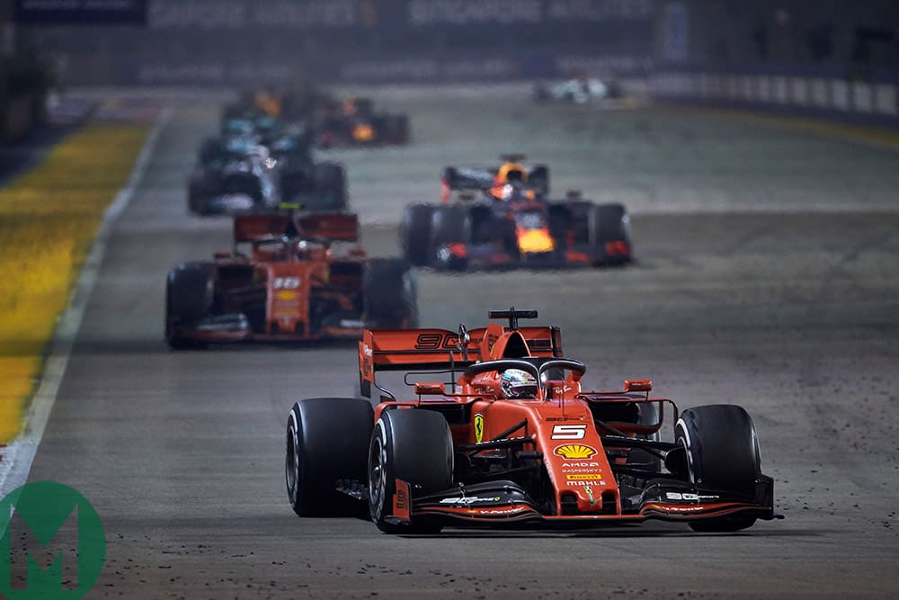 Sebastian Vettel leads the field after a safety car restart at the 2019 F1 Singapore Grand Prix