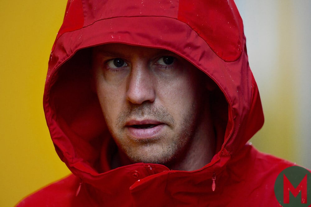 Sebastian Vettel in a hood on a rainy Friday at the 2019 Italian Grand Prix
