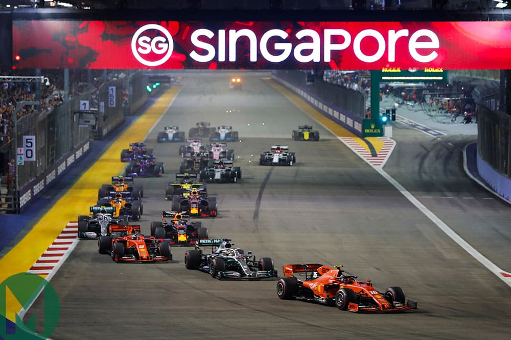 Charles Leclerc leads into the first corner at the start of the 2019 F1 Singapore Grand Prix