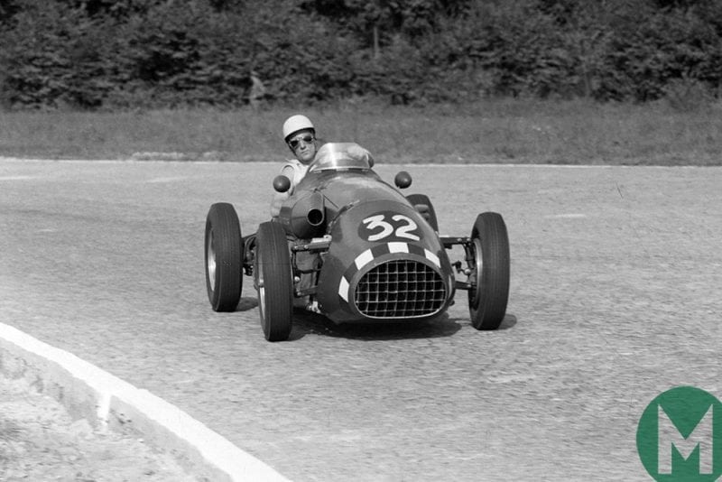 Stirling Moss leans as he takes a corner at the 1952 Italian Grand Prix