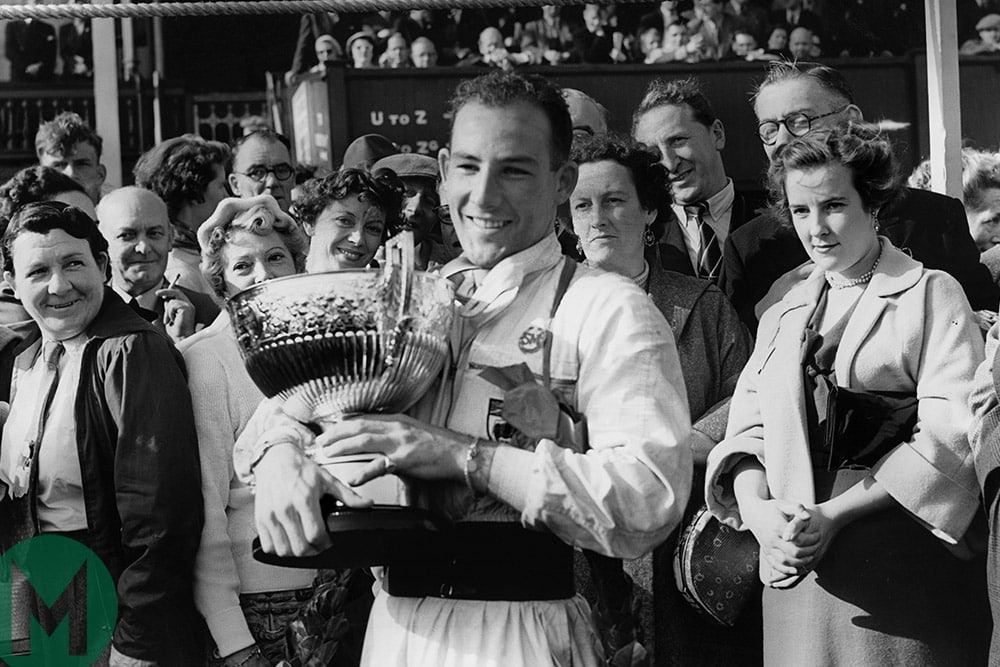 Sir Stirling Moss with the winning cup from the 1954 daily Telegraph Trophy at Aintree