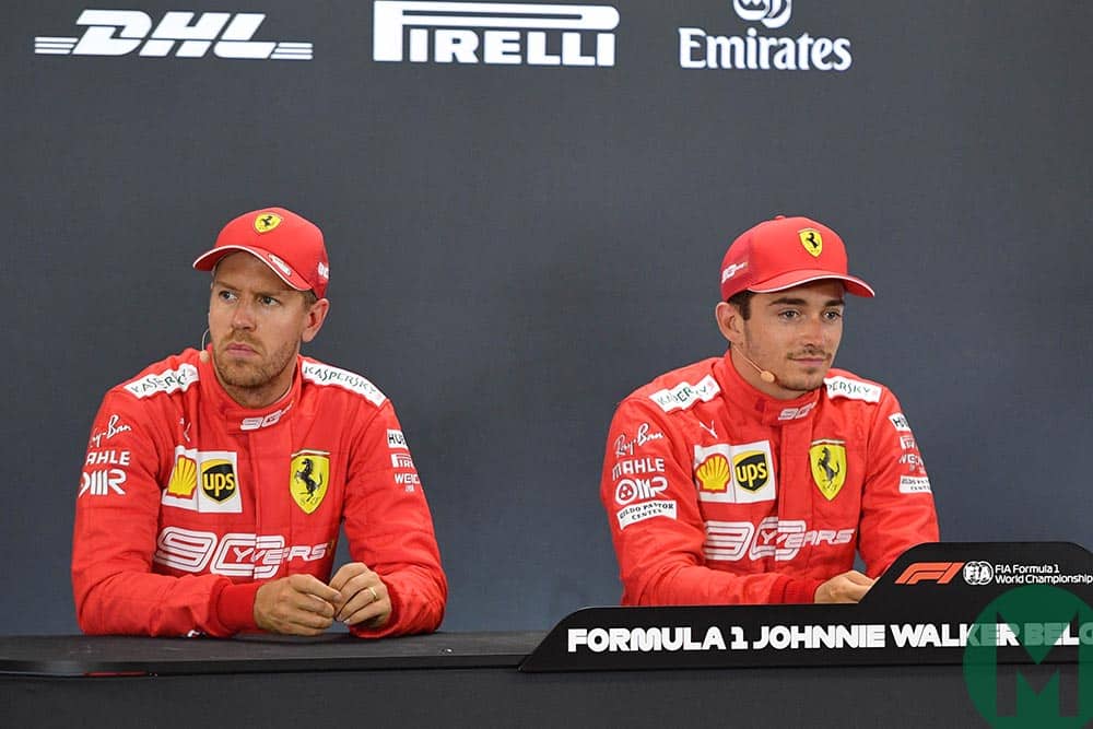 Sebastian Vettel looks away, sat next to pole-sitter Charles Leclerc at the 2019 Belgian Grand Prix