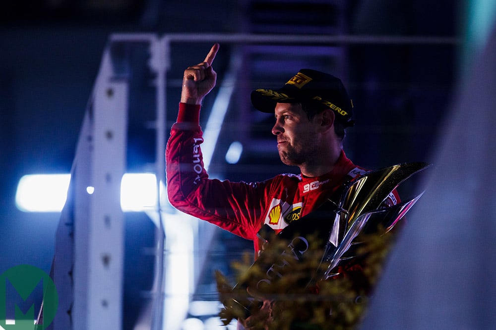 Sebastian Vettel on the podium after winning the 2019 Singapore Grand Prix