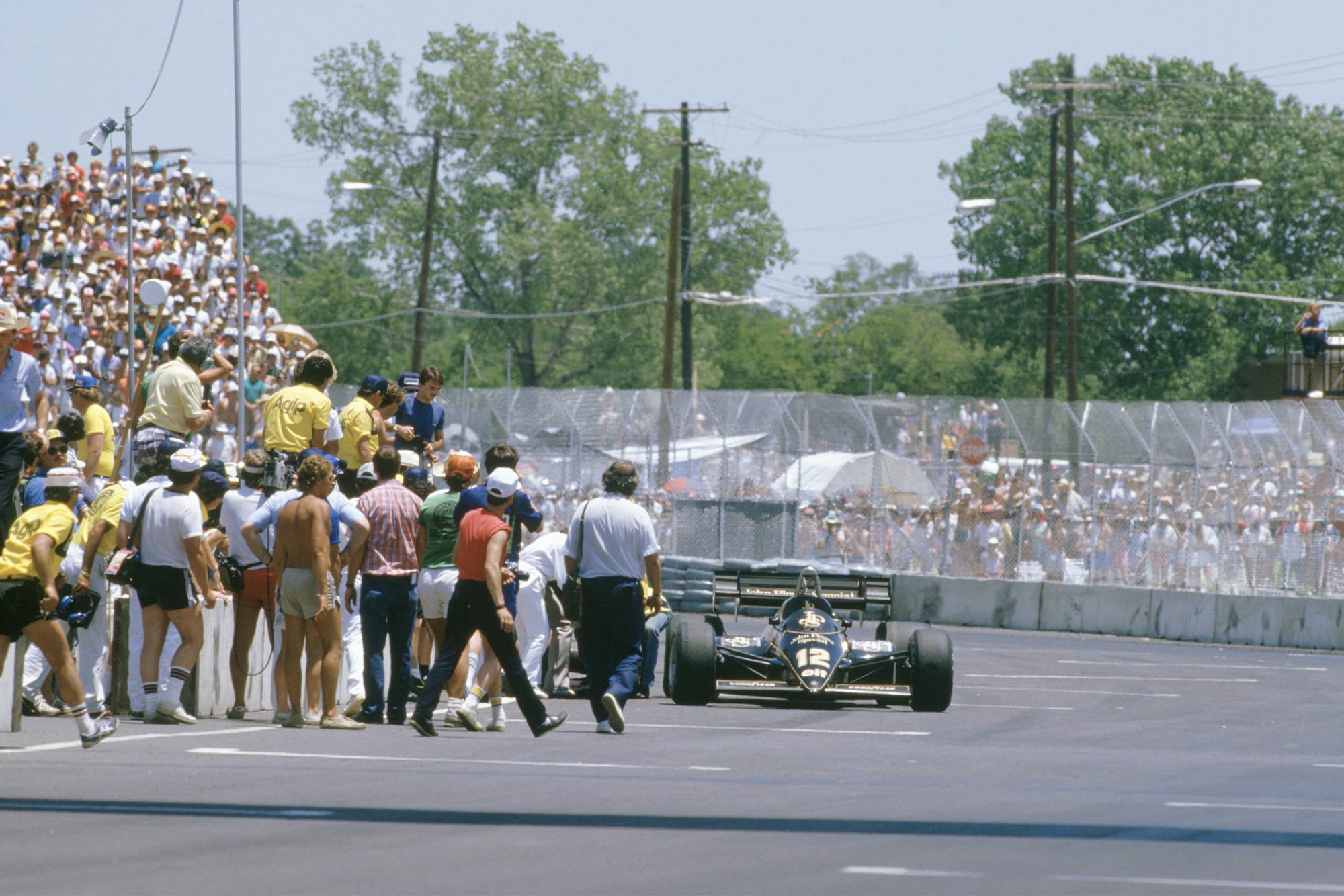 Nigel Mansell collapses trying to push his Lotus across the line at the 1984 Dallas Grand Prix