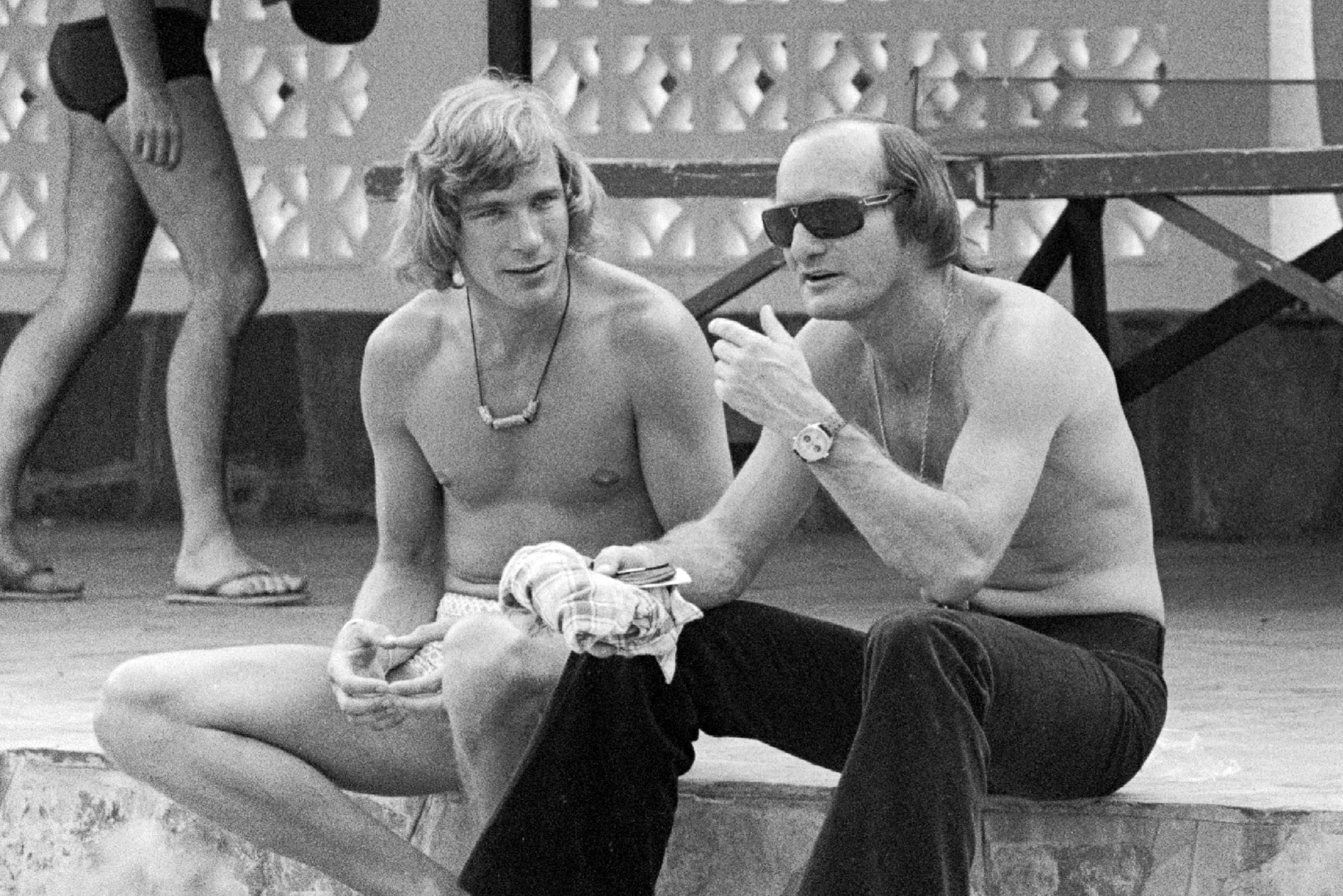 Mike Hailwood and James Hunt at the Kylami Ranch Hotel during the 1974 South African Grand Prix weekend