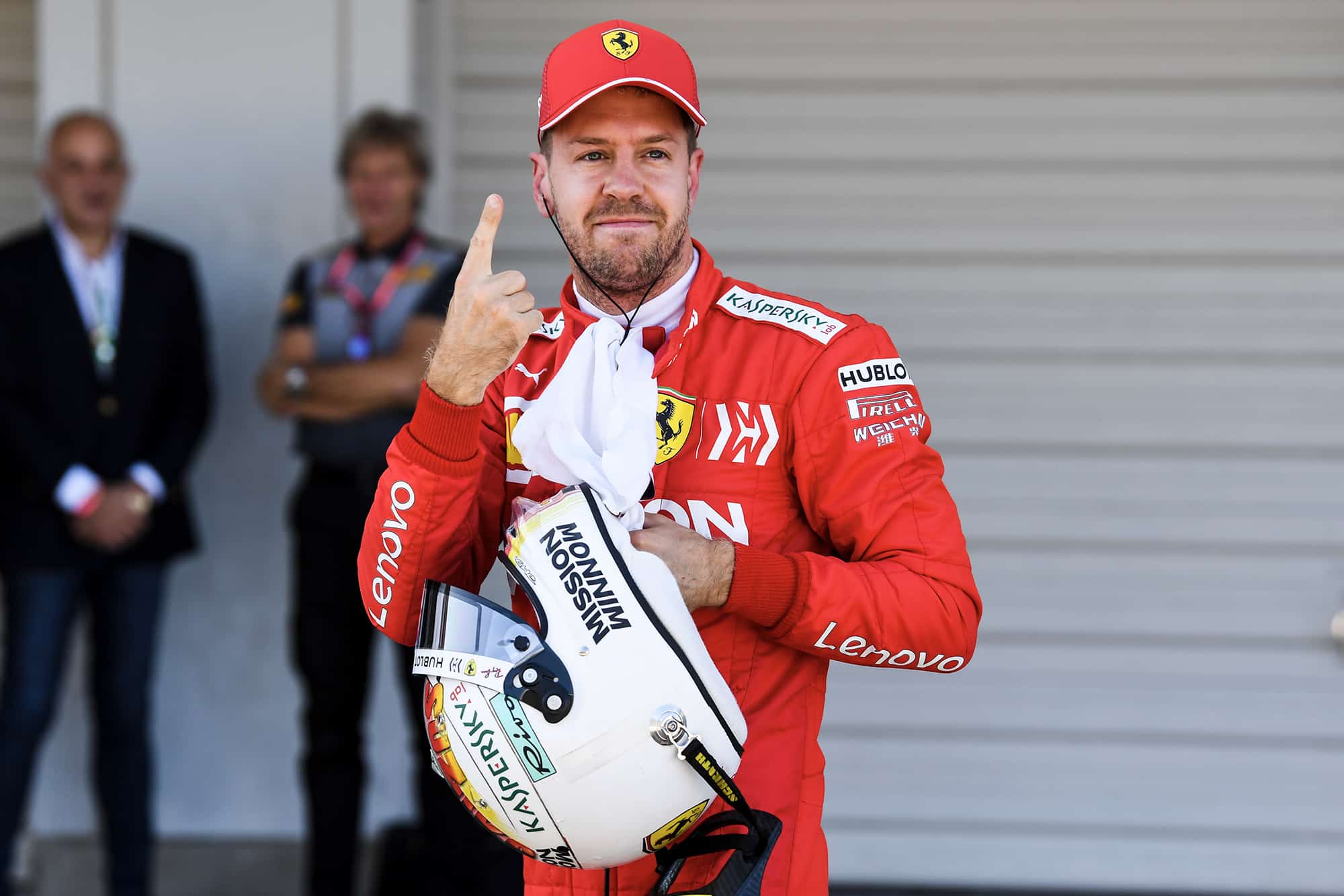 Sebastian Vettel makes the number one sign after qualifying on pole for the 2019 F1 Japanese Grand Prix