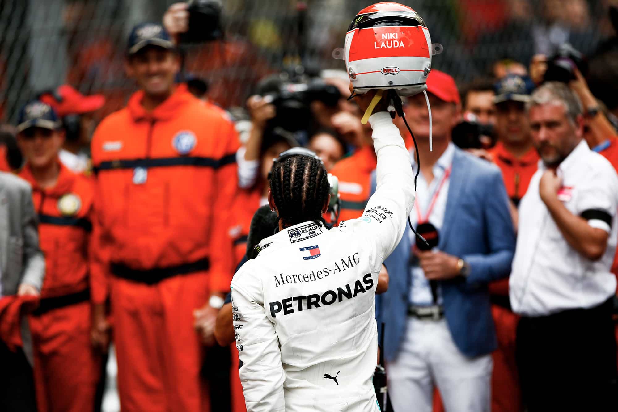 Lewis Hamilton raises his Niki Lauda tribute helmet at the 2019 Monaco Grand Prix