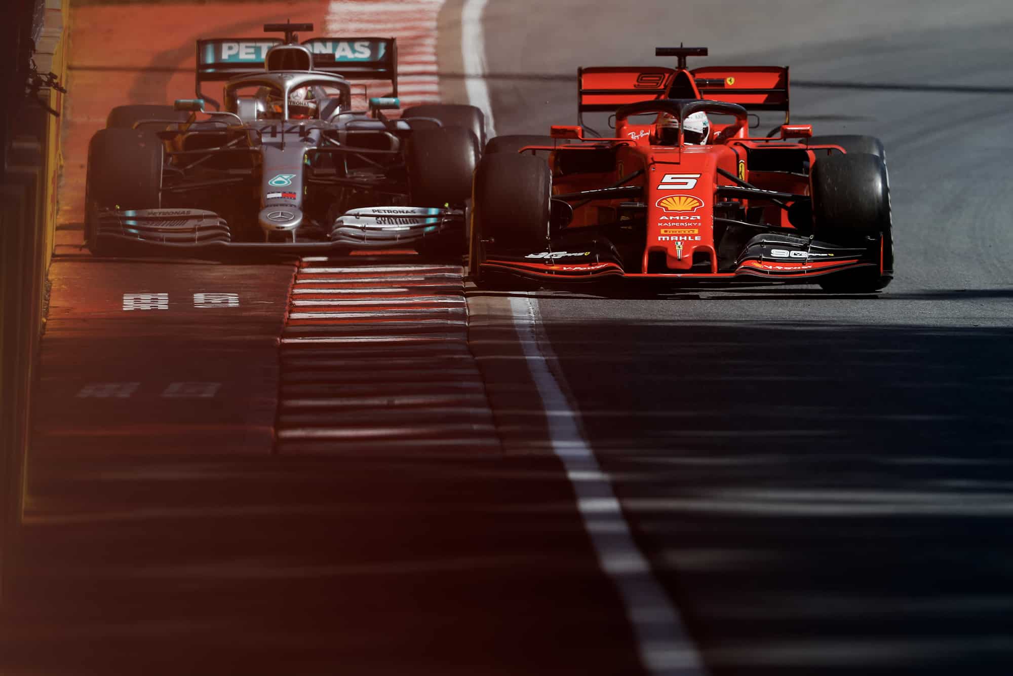Sebastian Vettel squeezes Lewis Hamilton against the wall during the 2019 Canadian Grand Prix